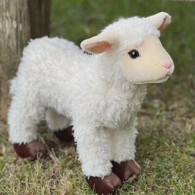 15 inch lamb stuffed animal plush toy shown outdoors with forest background
