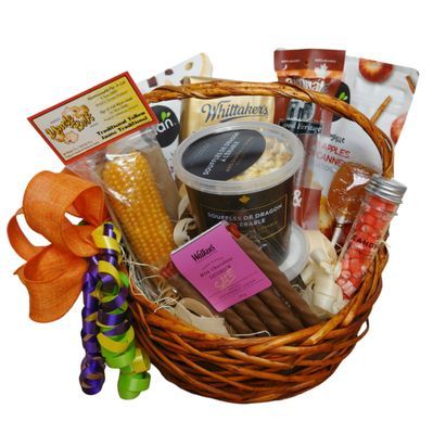 Joyful Treats Gift Basket with assorted snacks and sweets in a wicker basket

