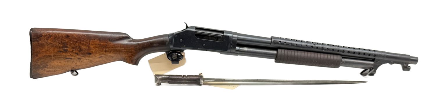 CG-0200 1897 Winchester 12 Ga 2.75" Pump Action Trench Gun Manufactured 1948, Original Condition. Bayonet is 1917 W/ Flaming Bomb US Stamped. Otherwise, Numbers Matching Firearm! CG-0200 1897 Winchester 12 Ga 2.75" Pump Action Trench Gun Manufactured 1948, Original Condition. Bayonet is 1917 W/ Flaming Bomb US Stamped. Otherwise, Numbers Matching Firearm!