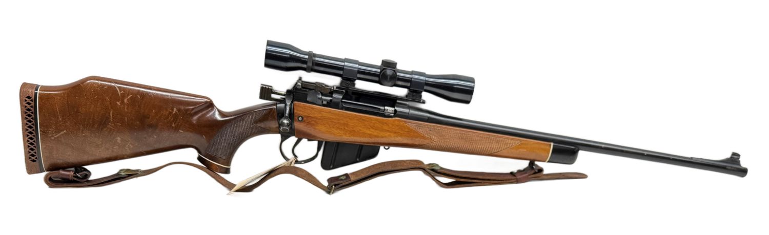 UG-20480 Lee Enfield Spoterized rifle (No 4 MK 1), 303 British. With scope mount and scope. Blueing is good, wood has handleing marks, bore is good. UG-20480 Lee Enfield Spoterized rifle (No 4 MK 1), 303 British. With scope mount and scope. Blueing is good, wood has handleing marks, bore is good.