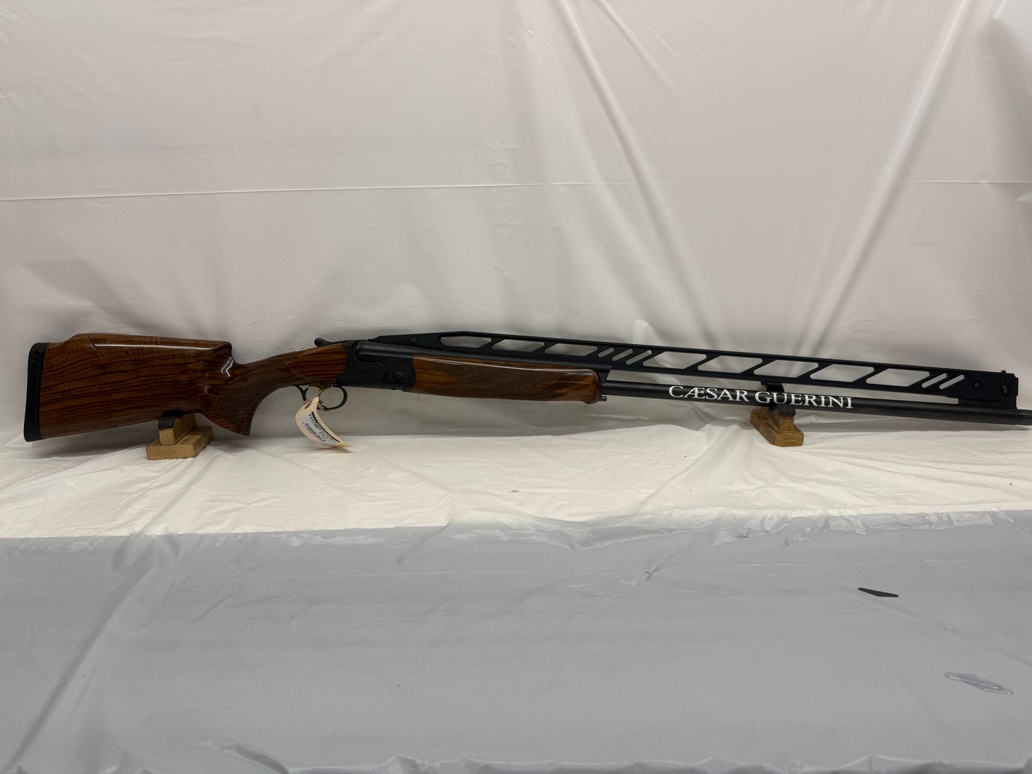 CG-0243 Caesar Guerini Summit Trap Combo, 34" Un-Single Barrel and 32" O/U Barrels. In Original Case with 8 Choke Tubes, in New Condition.