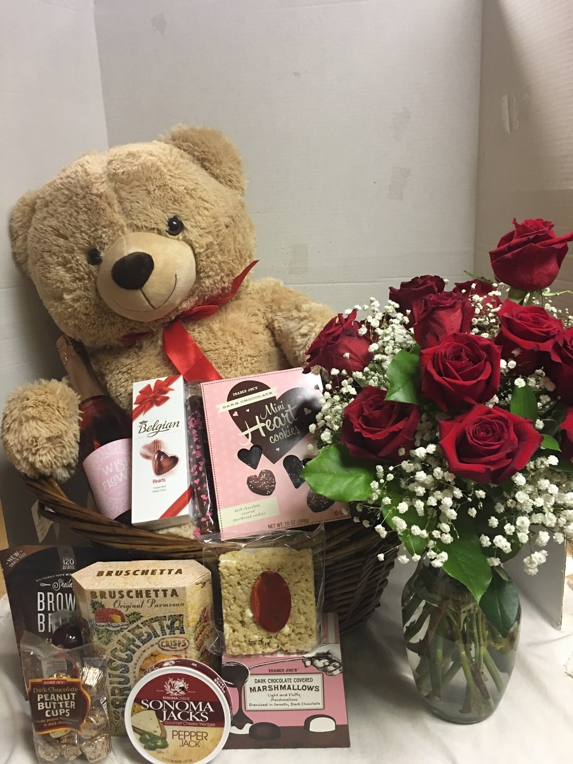 big teddy bear and roses