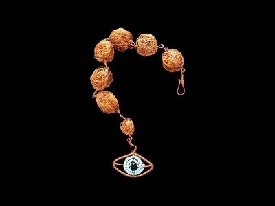 Copper bead bracelet with evil eye pendant