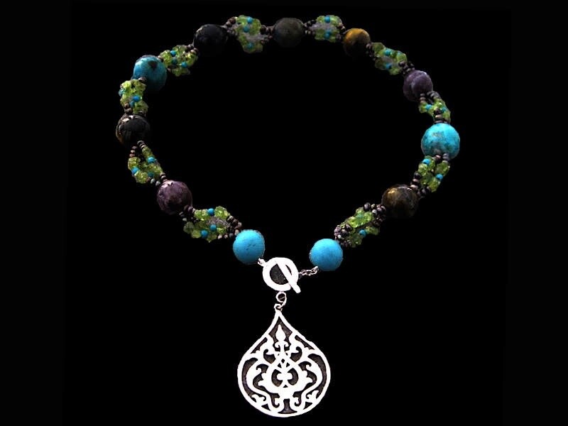 EMBROIDERED GEMSTONE NECKLACE WITH LARGE ARABESQUE FRONT CLOSURE