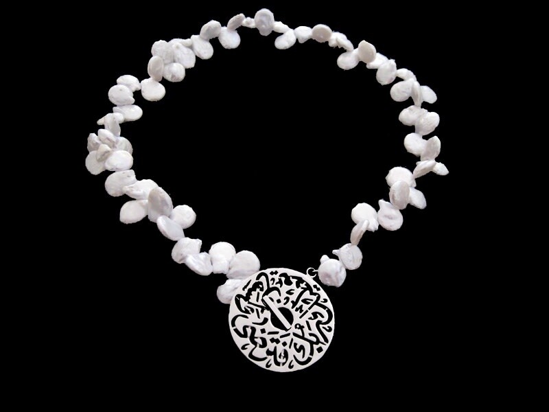 IRREGULAR PEARLS WITH MEDIUM SILVER DISC CLOSURE
