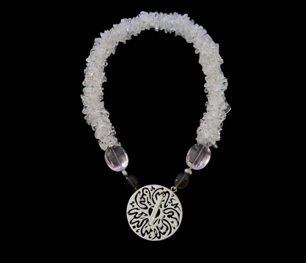 CORD NECKLACE WITH CUT STONES. DISC CLOSURE
