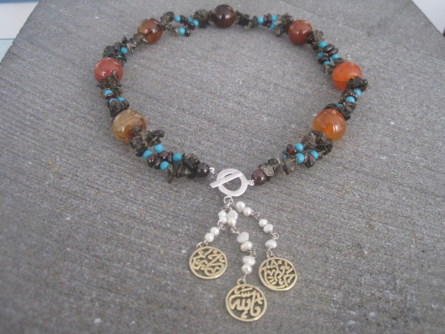 EMBROIDERED NECKLACE WITH FRONT CLOSURE AND GP FALLAH KHEIR TASSELS