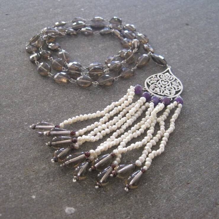 LONG GEMSTONE NECKLACE. LARGE ARABESQUE AND TASSELS