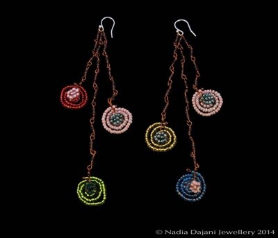 Long bead swirl shower earrings