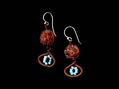 Copper bead earring with evil eye motif