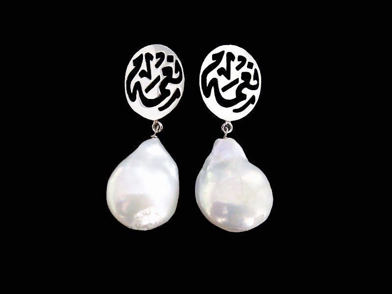 CLIP ON EARRINGS WITH BAROQUE PEARL DROP