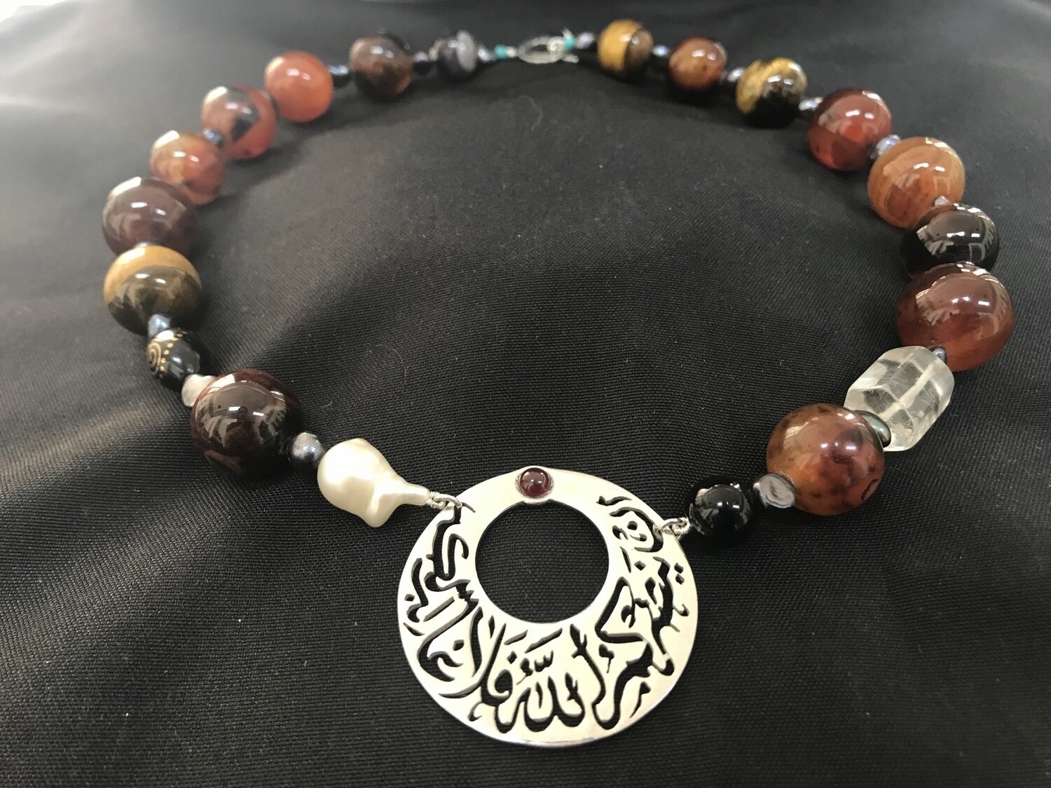 CROCHET NECKLACE WITH CRESCENT AND GARNET CABOCHON
