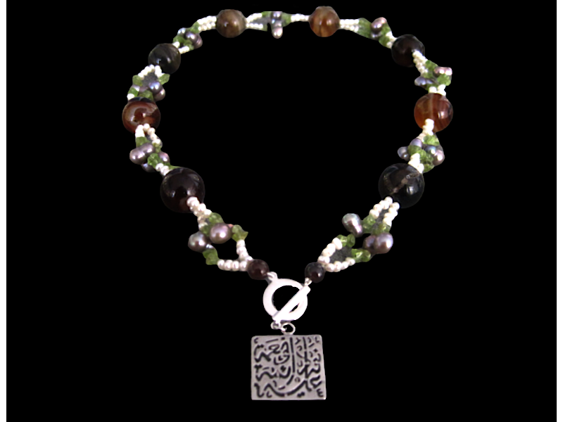 EMBROIDERED NECKLACE WITH FRONT CLOSURE AND NIMA AFIA