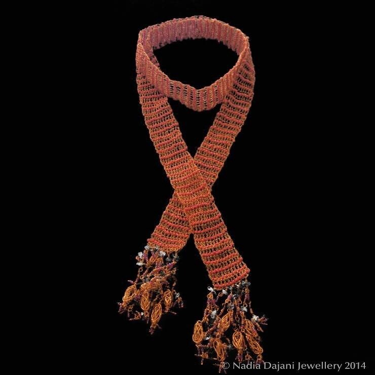 Knitted copper scarf with glass beads and tassels