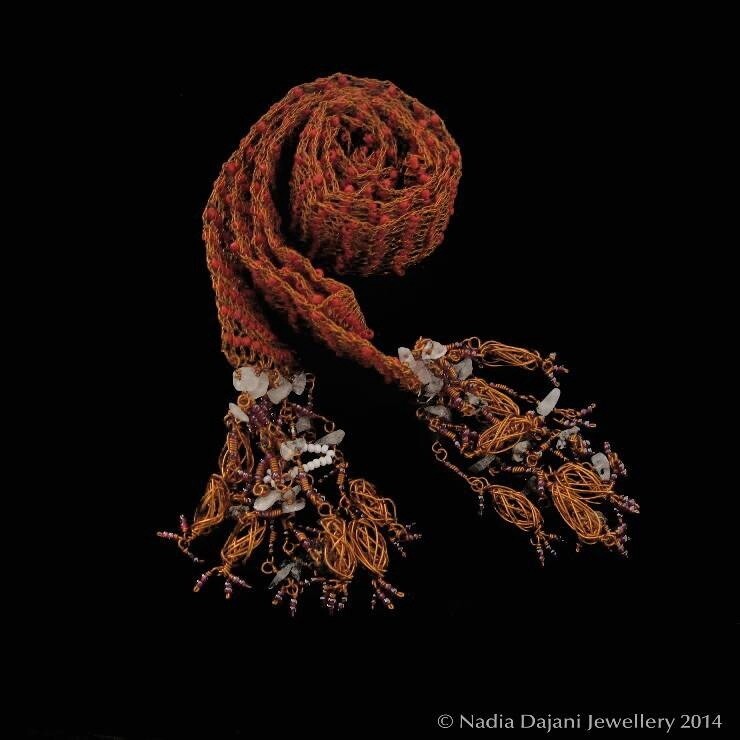 Knitted copper scarf with glass beads and tassels