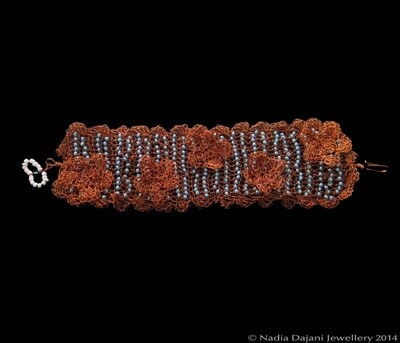 Braided copper bracelet with crochet flowers