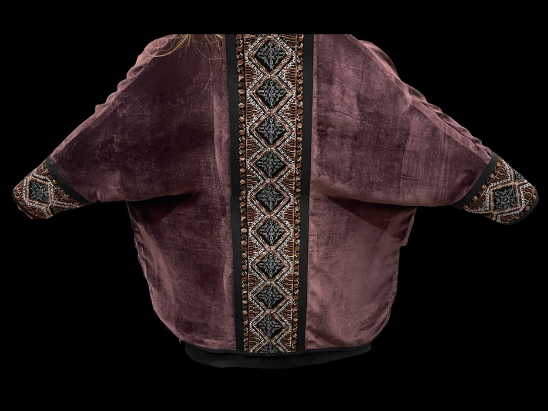 Velvet jacket with embroidered back and cuffs.