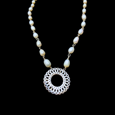 Pearl Wire Necklace with Small Karma Motif