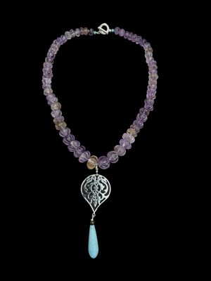 Faceted Amethyst Arabesque Necklace With Calcite Drop