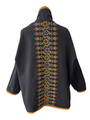 The Round Jacket in Black With Orange Trim and Green Hand Embroidery