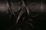 Water-repellent crinkled black laminate from Tahari, 57" wide