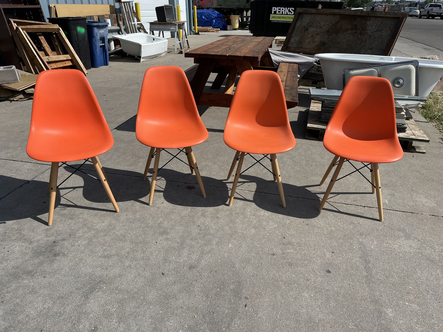 Set of 4 Modern Molded Plastic Dining Chairs – Orange with Wood Legs