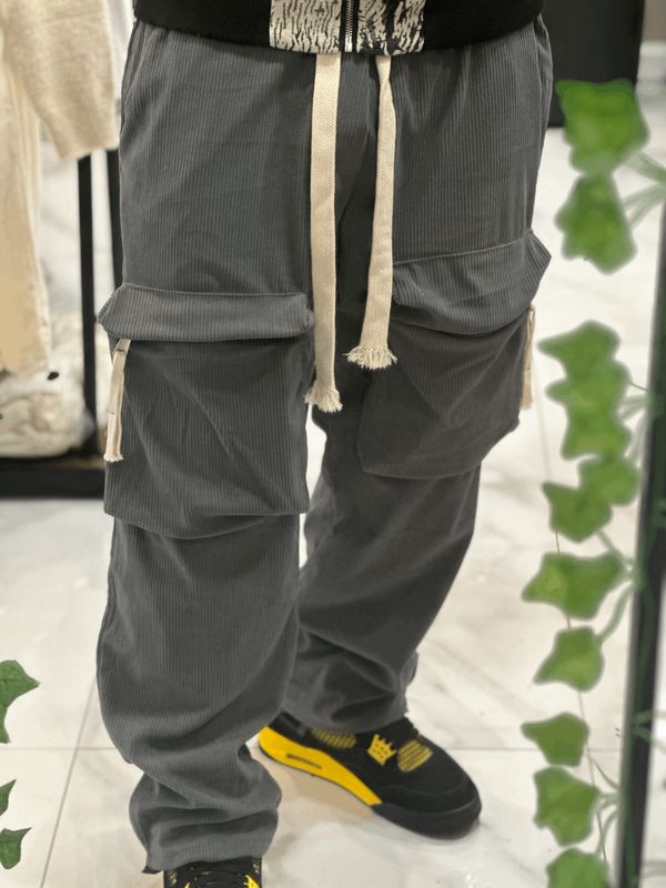 Pantalone a costine con tasconi frontali fondo largo regolabile
