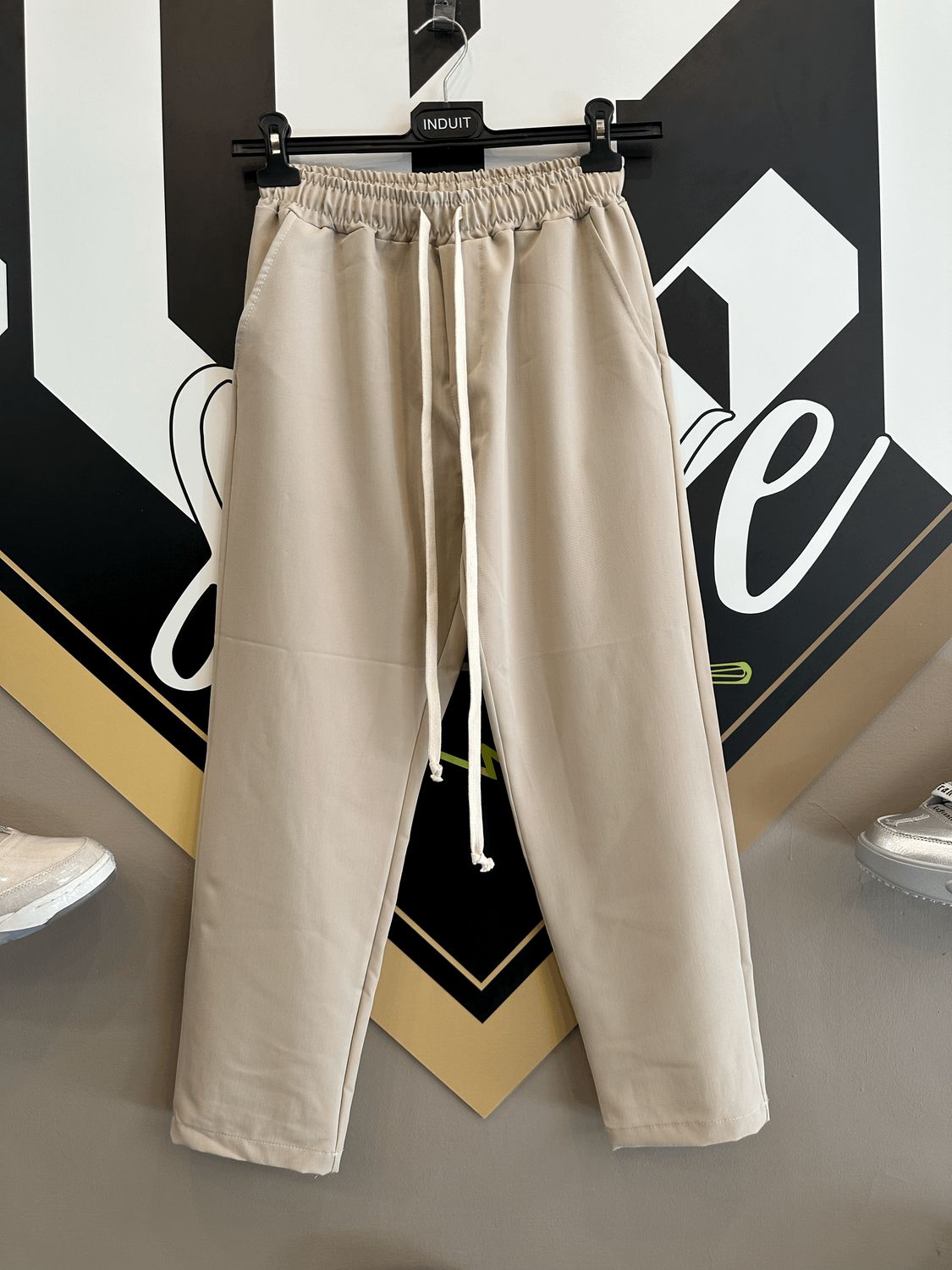 Pantalone elegante fondo largo crema