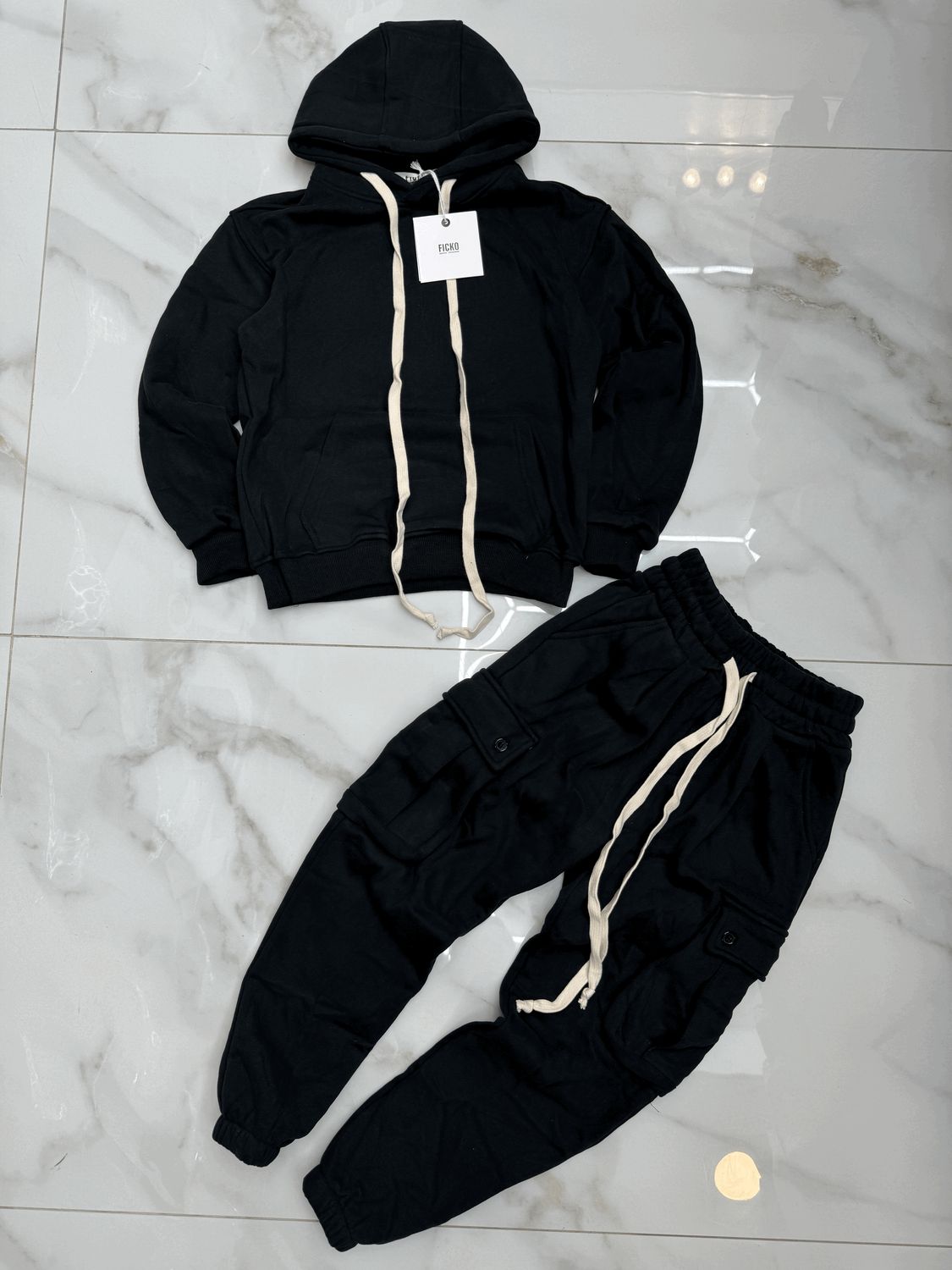 Tuta Completa boxy fit felpata BAMBINO tinta unita nero Tuta Completa boxy fit felpata BAMBINO tinta unita nero