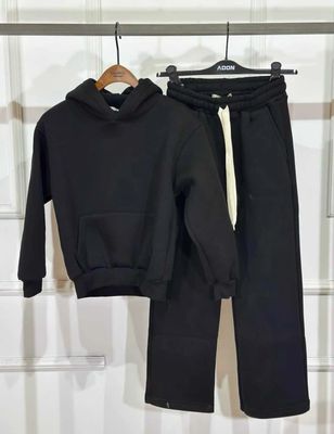 Tuta completa oversize fondo largo felpata BAMBINO nera Tuta completa oversize fondo largo felpata BAMBINO nera