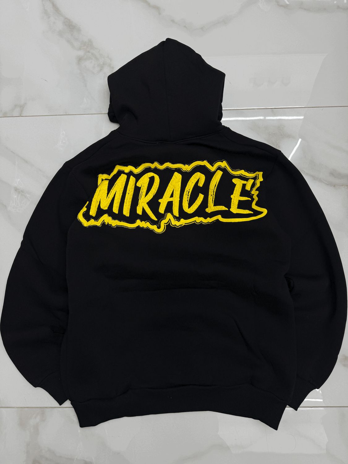 Felpa BAMBINO con cappuccio e stampa sul retro " Miracle " Felpa BAMBINO con cappuccio e stampa sul retro " Miracle "