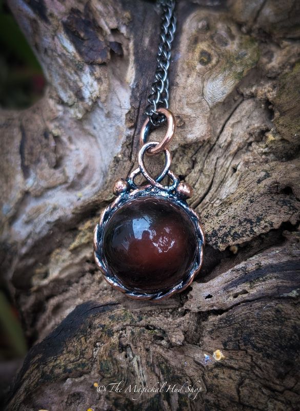 Pool of the Steadfast: Brown agate in Pool of Light Design with Celtic Weave in Copper – a beautiful energy of strength and stability