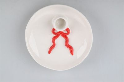 Aardewerk kaarsenstandaard plateau · bow