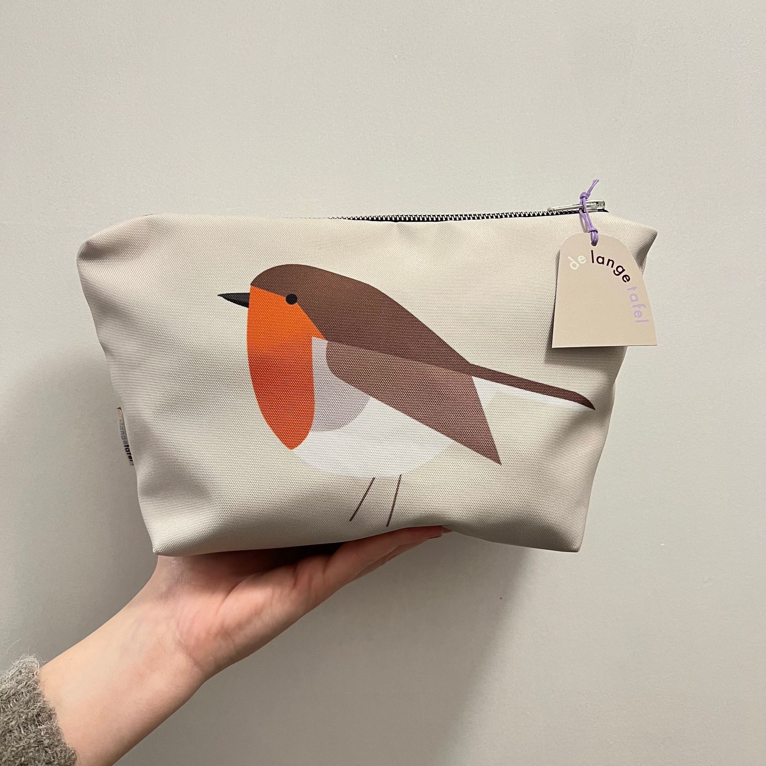 Toilettas · roodborst