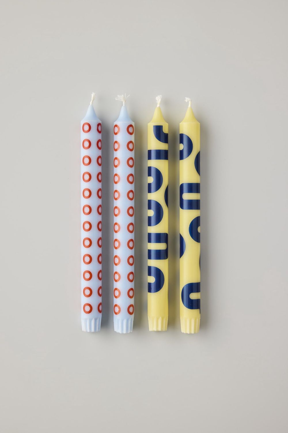 Studio About · kaarsen yellow/blue