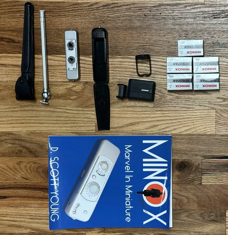 Minox mini spy camera with accessories and Minox Marvel in miniature book