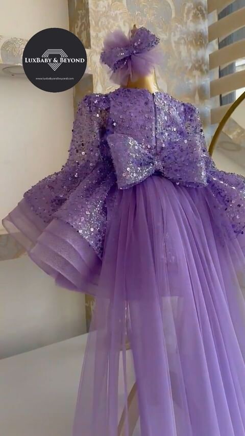 Luxurious Lilac frill dress with trail and headband.
