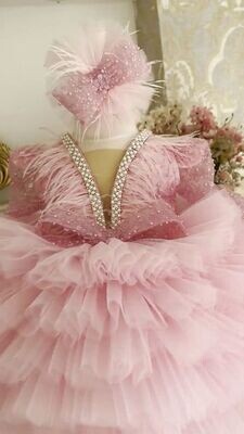 Luxurious pink frill dress with plain trail and headband.