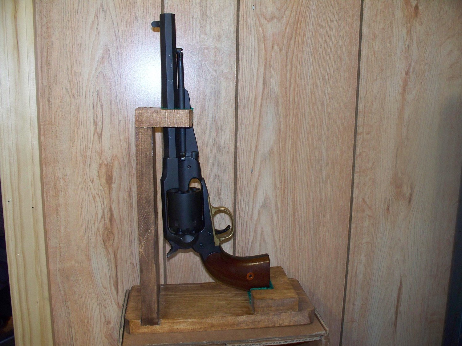 Wooden stand for loading cap and ball revolvers