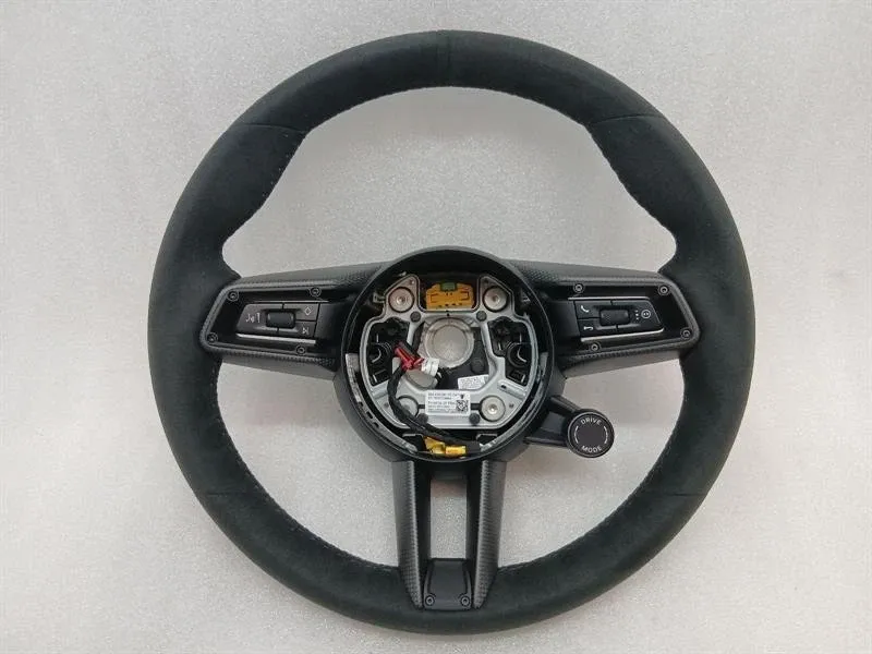 Porsche 911 (992) Porsche 911 992 Wheel 992419091TC OX7 Steering Wheel Alcantara Carbon Heated Sport 36CM Body type: Convertible
Fuel: Petrol