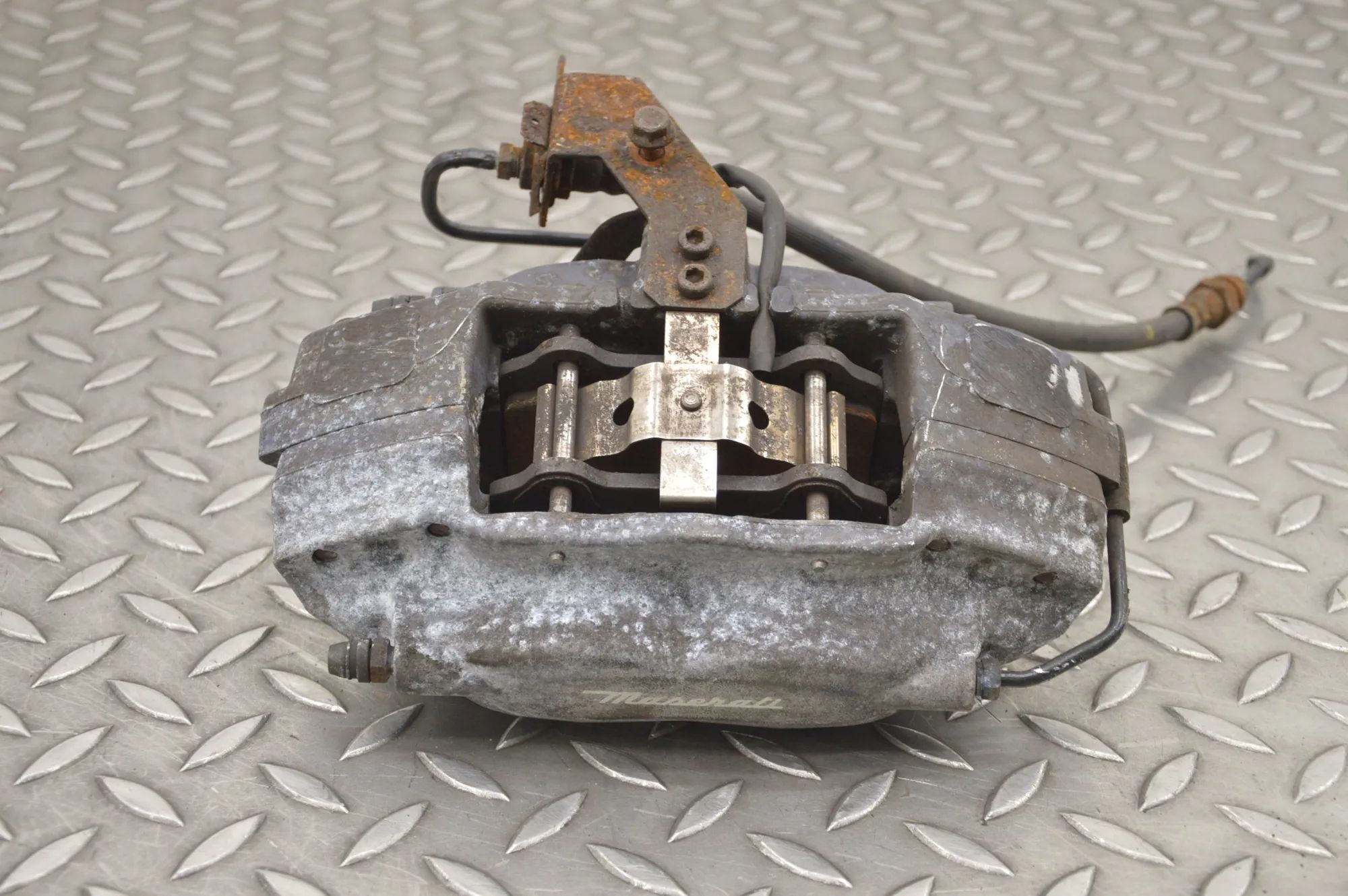 Maserati Ghibli Brake caliper — rear left Brake caliper — rear left — MASERATI GHIBLI (M1...