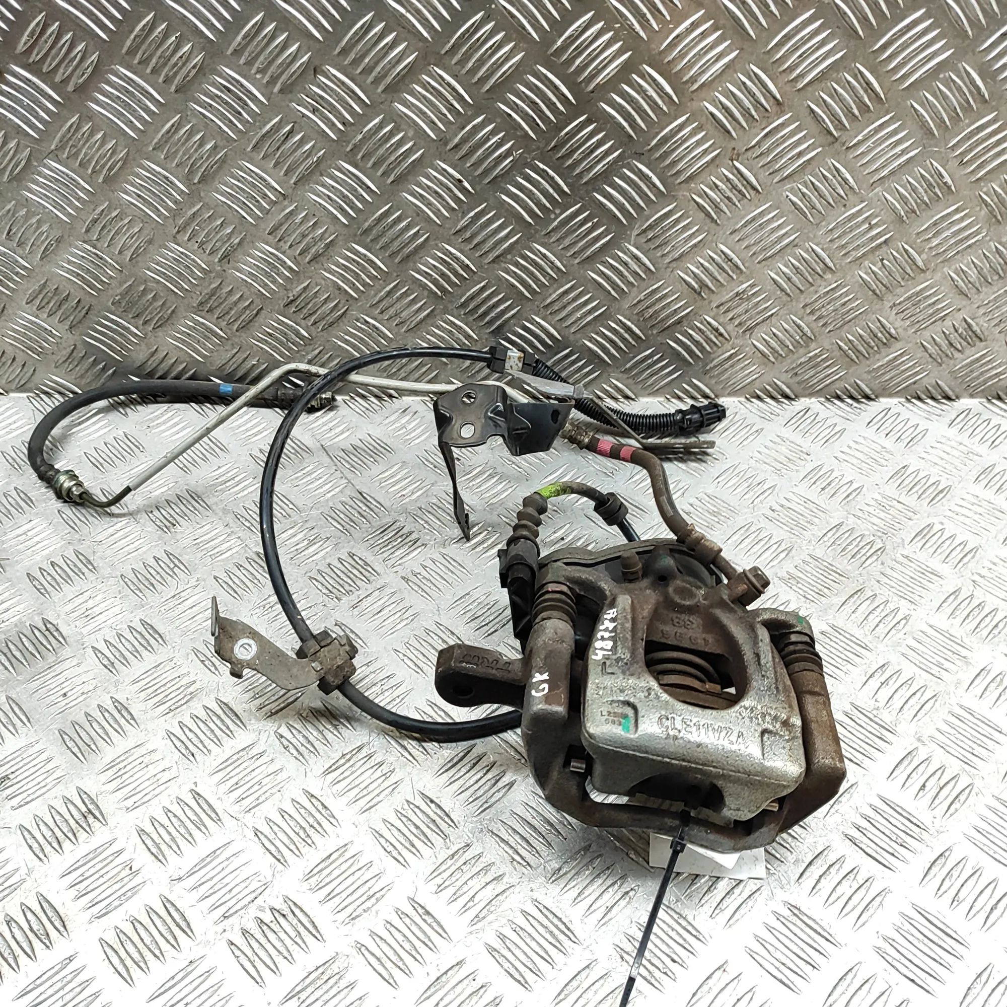 Nissan Leaf Brake caliper — rear left Brake caliper — rear left — NISSAN LEAF (ZE1) (...
