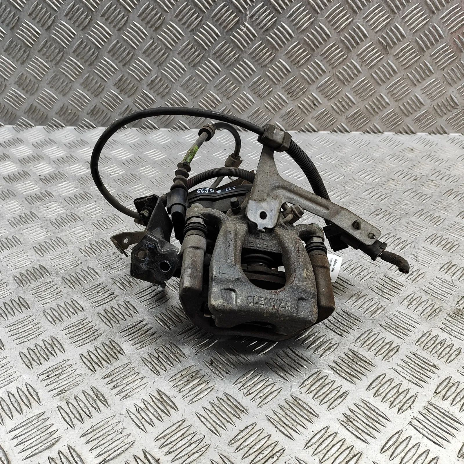 Nissan Leaf Brake caliper — rear left Brake caliper — rear left — NISSAN LEAF (ZE1) (...
