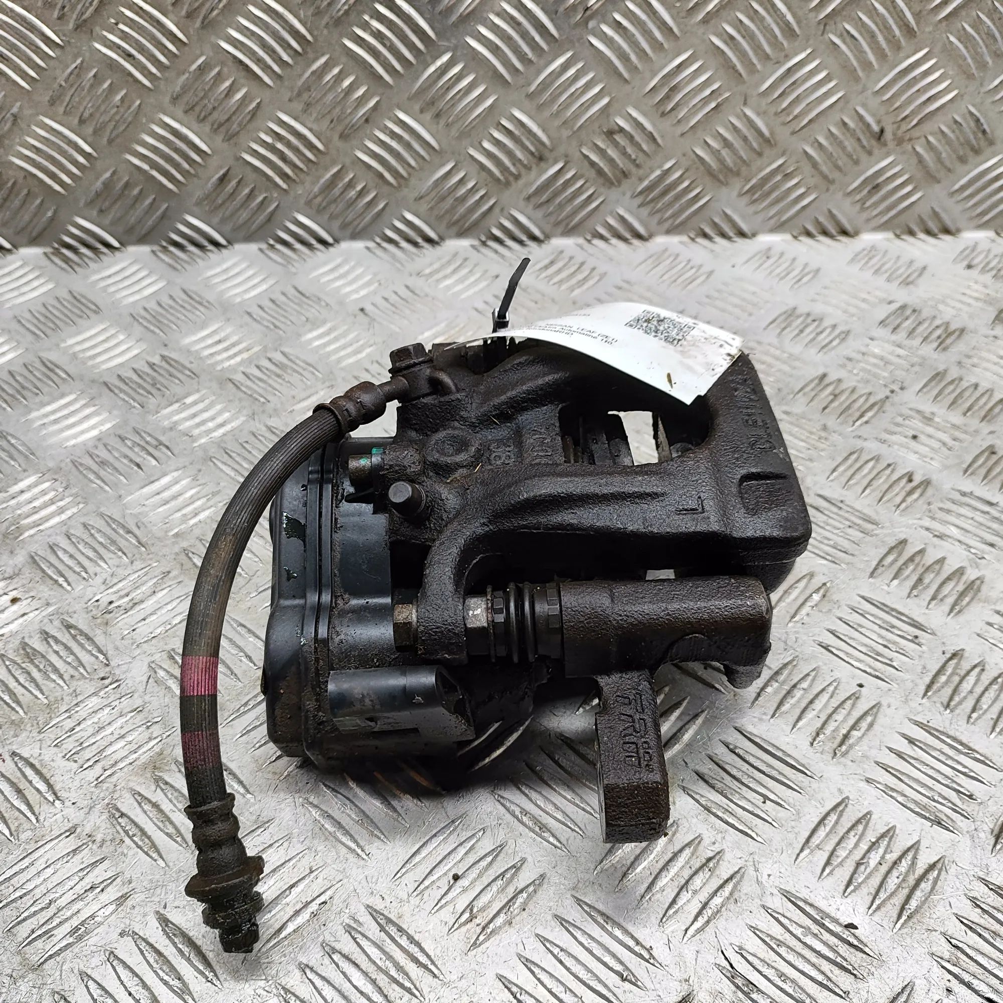 Nissan Leaf Brake caliper — rear left Brake caliper — rear left — NISSAN LEAF (ZE1) (...