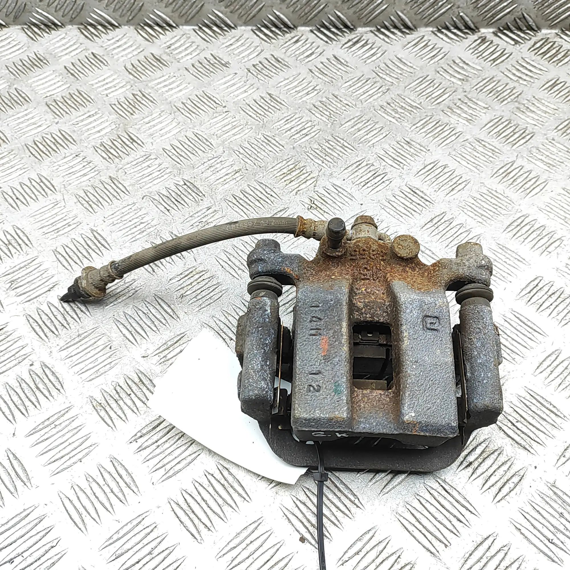 Nissan Leaf Brake caliper — rear left Brake caliper — rear left — NISSAN LEAF (ZE1) (...
