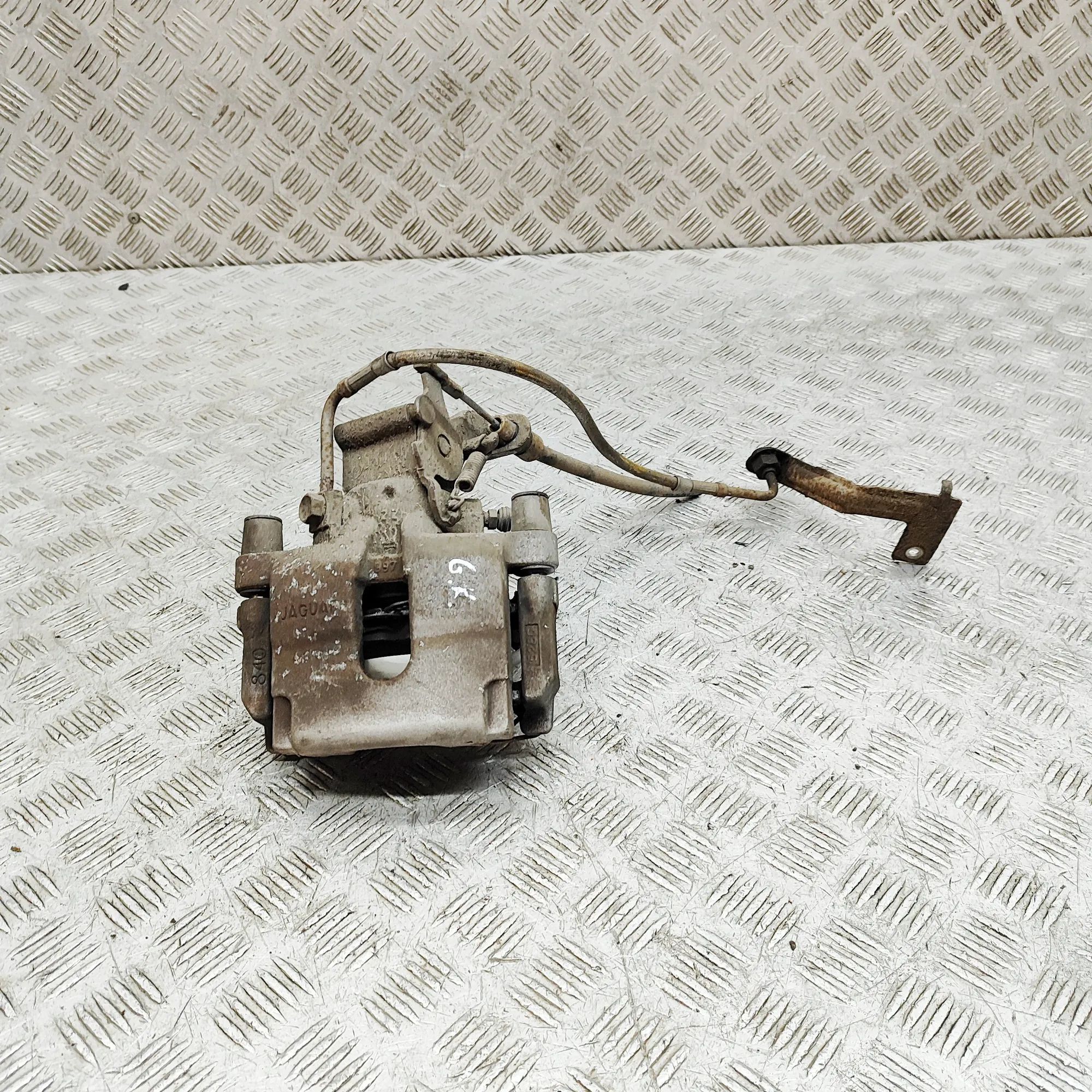 Jaguar XK Brake caliper — rear left Brake caliper — rear left — JAGUAR XK (Coupe X1...
