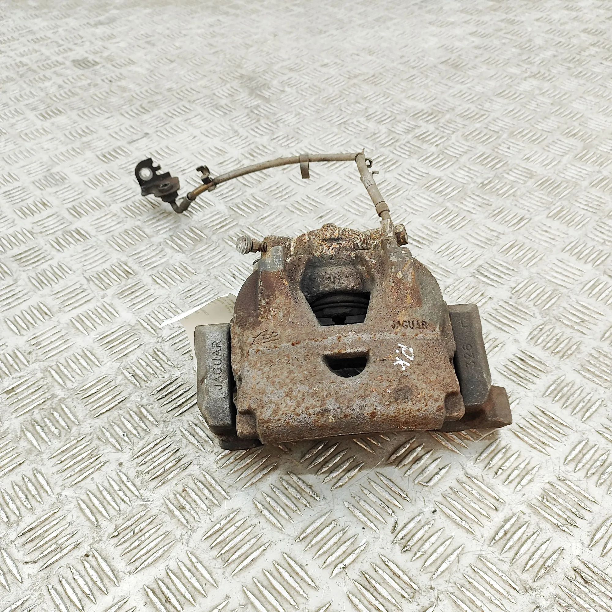 Jaguar XK Brake caliper — front left Brake caliper — front left — JAGUAR XK (Coupe X...