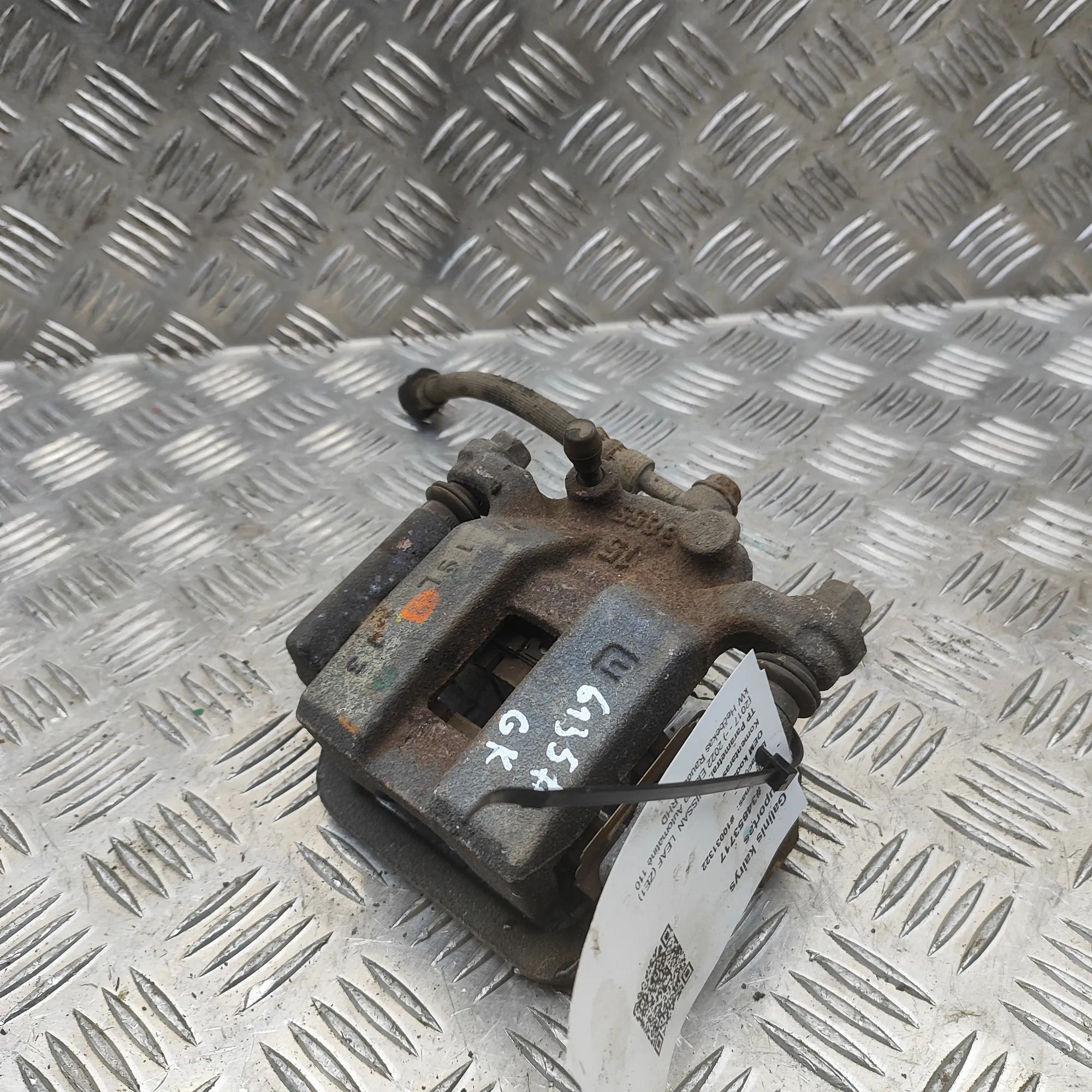 Nissan Leaf Brake caliper — rear left Brake caliper — rear left — NISSAN LEAF (ZE1) (...
