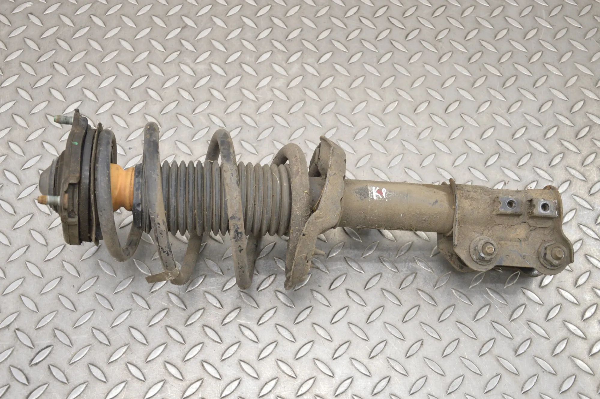 Kia Optima (JF) Shock absorber — front left