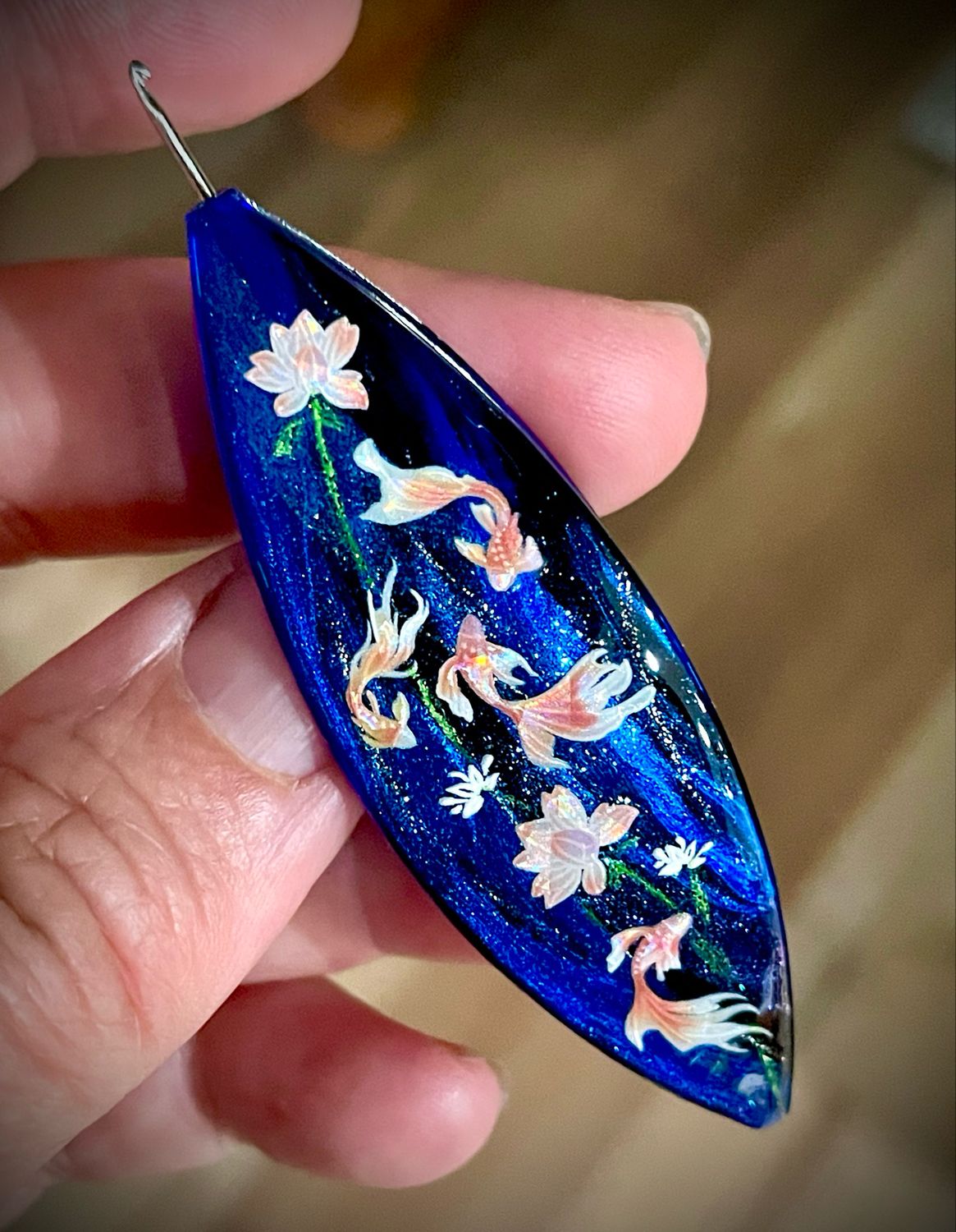 Moonlit shuttle decorated on one side, “Beneath the Water Lilies”